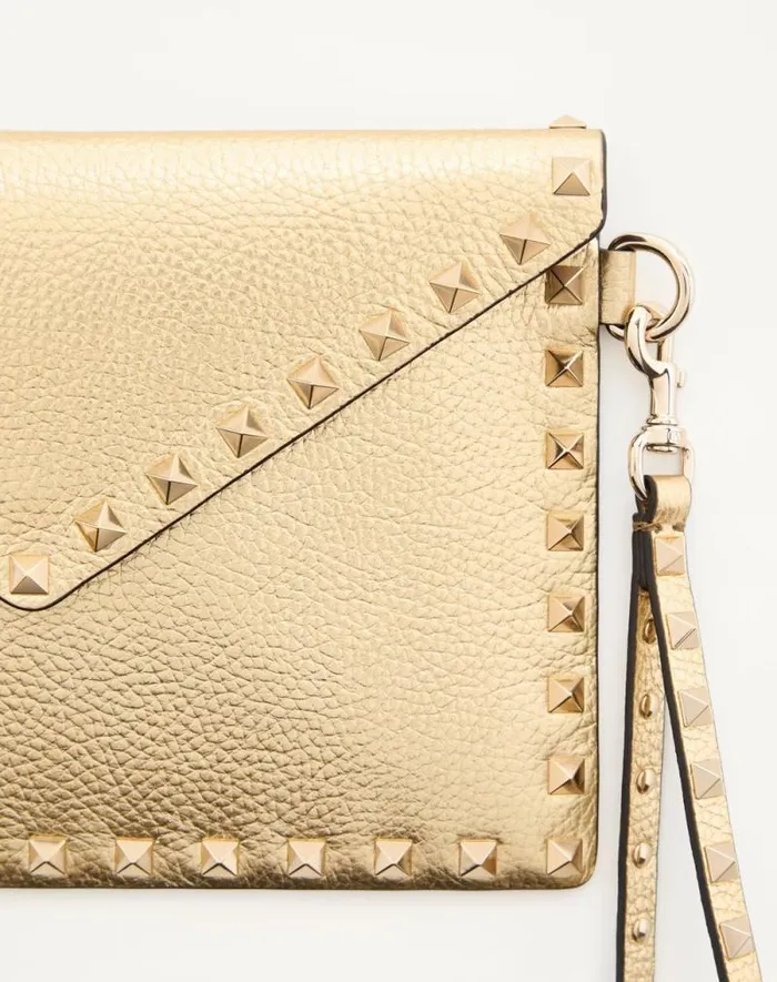 Valentino Clutches Woman Rockstud Laminated Grainy Calfskin Clutch Bag For Woman In Antique Brass Antique Brass Valentino Clutches Woman Rockstud Laminated Grainy Calfskin Clutch Bag For Woman In Antique Brass Antique Brass