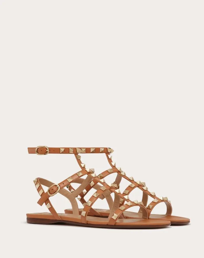 Valentino Sandals Woman Rockstud Flat Calfskin Sandal With Straps For Woman In Almond Almond Valentino Sandals Woman Rockstud Flat Calfskin Sandal With Straps For Woman In Almond Almond