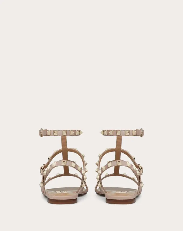 Valentino Sandals Woman Rockstud Flat Calfskin Sandal With Straps For Woman In Almond Almond Valentino Sandals Woman Rockstud Flat Calfskin Sandal With Straps For Woman In Almond Almond
