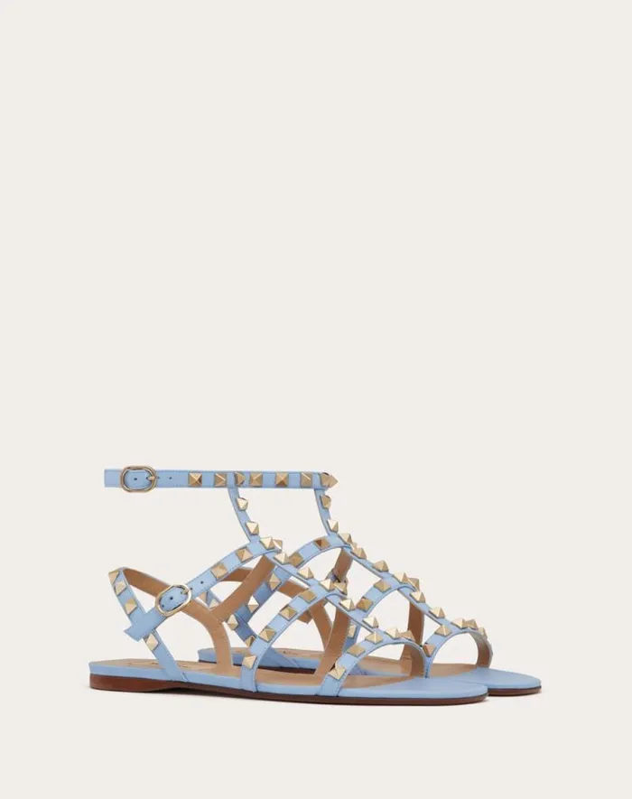 Valentino Sandals Woman Rockstud Flat Calfskin Sandal With Straps For Woman In Azure Azure Valentino Sandals Woman Rockstud Flat Calfskin Sandal With Straps For Woman In Azure Azure