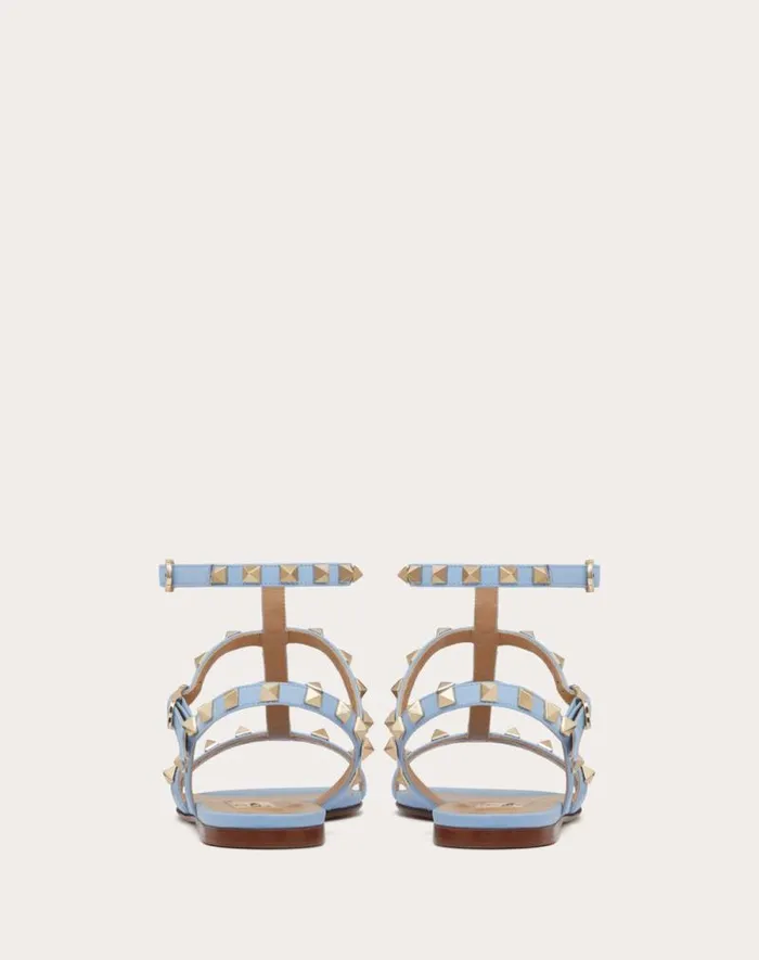 Valentino Sandals Woman Rockstud Flat Calfskin Sandal With Straps For Woman In Azure Azure Valentino Sandals Woman Rockstud Flat Calfskin Sandal With Straps For Woman In Azure Azure