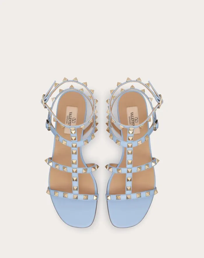 Valentino Sandals Woman Rockstud Flat Calfskin Sandal With Straps For Woman In Azure Azure Valentino Sandals Woman Rockstud Flat Calfskin Sandal With Straps For Woman In Azure Azure
