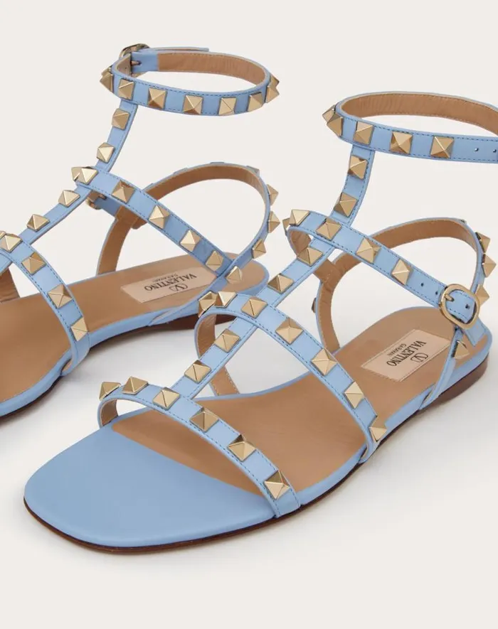 Valentino Sandals Woman Rockstud Flat Calfskin Sandal With Straps For Woman In Azure Azure Valentino Sandals Woman Rockstud Flat Calfskin Sandal With Straps For Woman In Azure Azure